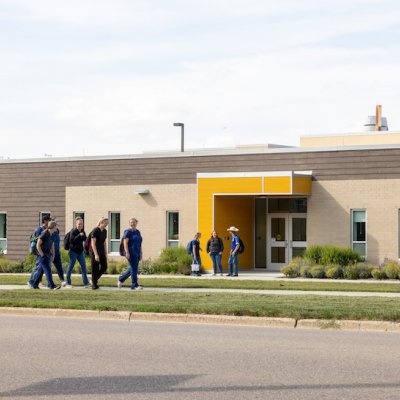 Students walking in front of veterinary medicine building
