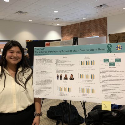 Photo of May Dang, WGSS minor, presenting research at the annual EXPL Expo