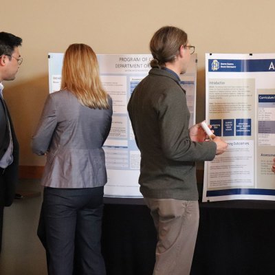 faculty gathered for poster session