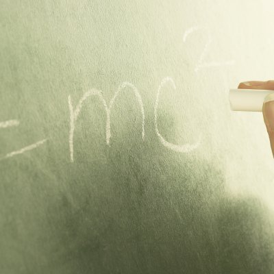 E=MC2 formula written on chalkboard