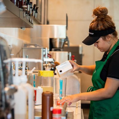 Starbucks barista making a drink