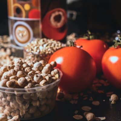 brown nuts beside tomatoes