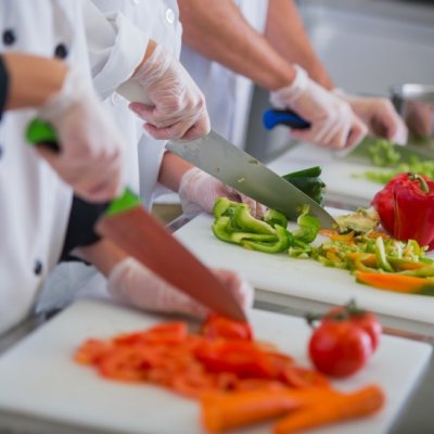students chopping bell peppers and carrots