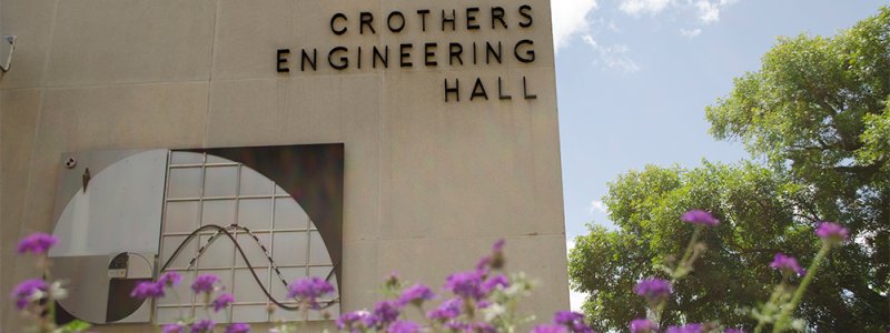 image of CrothersEngineering Hall building with flowers in the foreground 