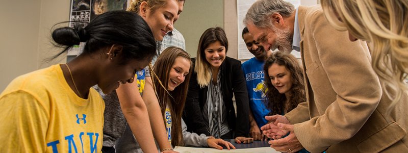 Students gather around Darrell Napton, a professor in the Department of Geography and Geospatial Sciences.