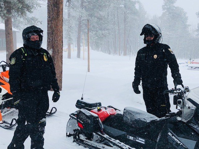GFP officers and snowmobiles