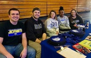 Students sitting at booth to raise awareness of Type 1 Diabetes