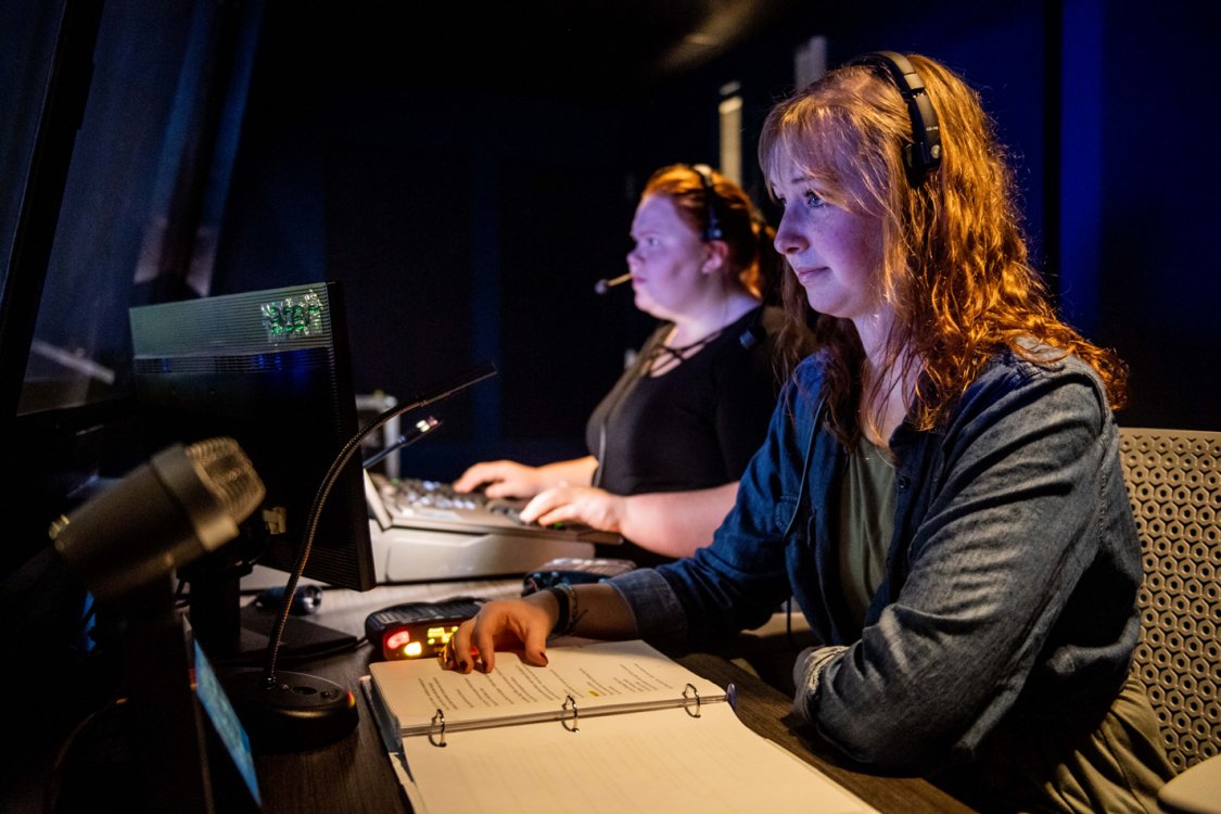 The stage manager and light board operator during a production.