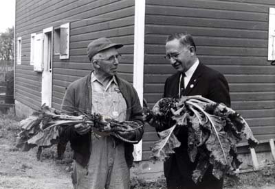 Reifel talks sugar beets with a farmer