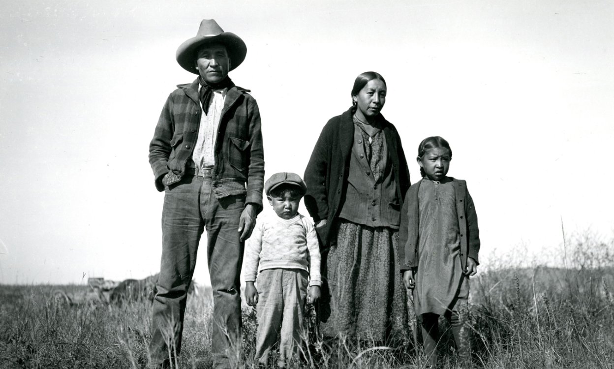 Photograph of  "Sam Spotted War Bonnet and Family" by Eugene Buechel
