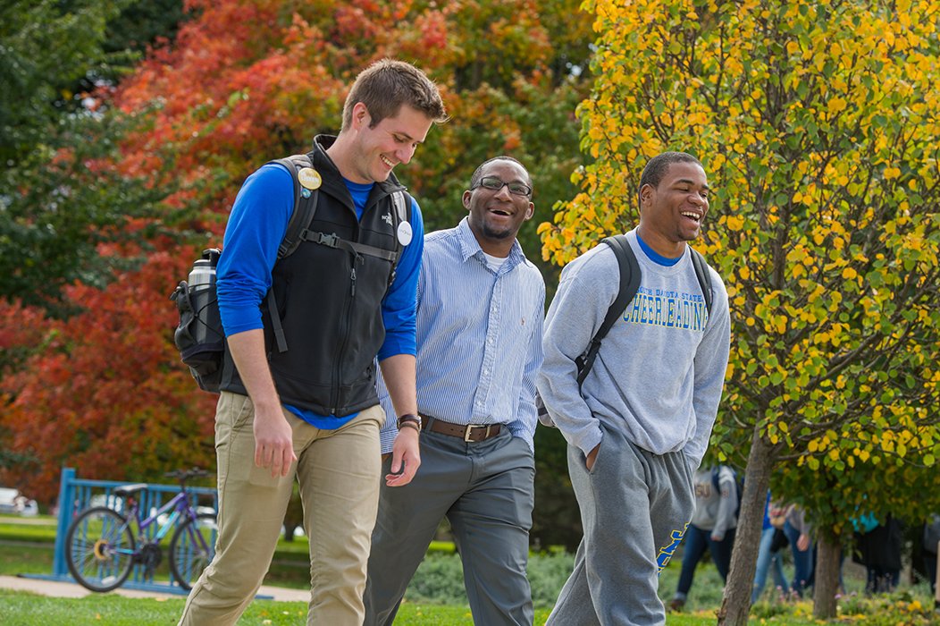 Male students walking on campus