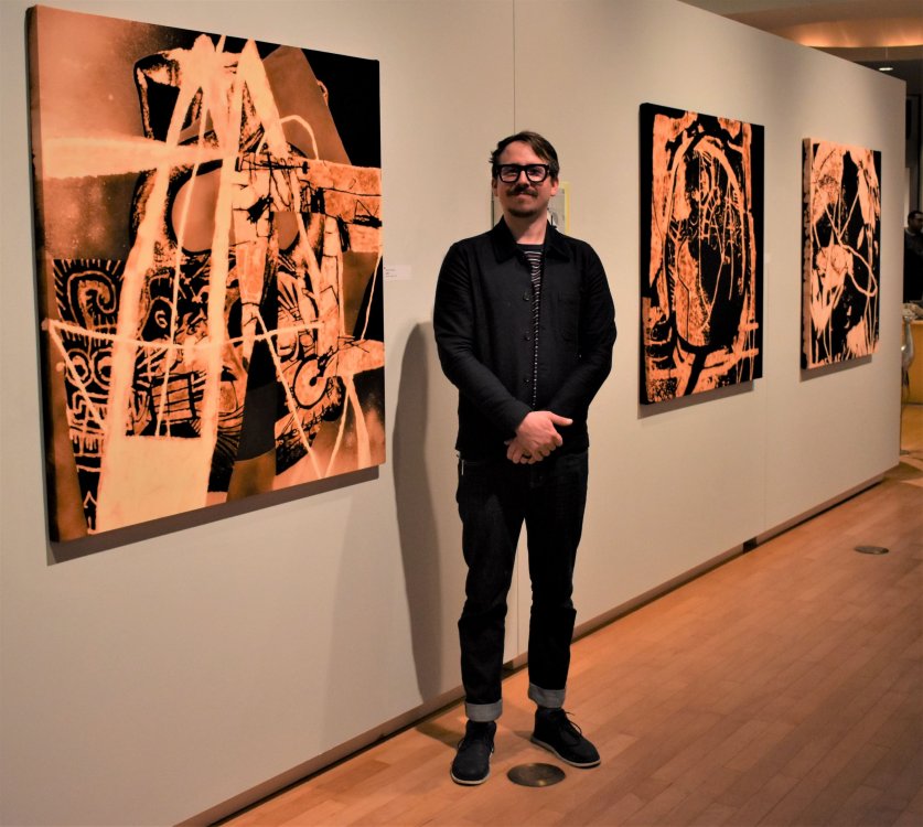 Peter Reichardt with works in the museum's 2017 exhibition, "Peter Reichardt and Andres Torres: imPULSE"