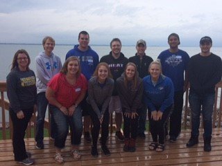 Students at the retreat pose for a group photo by the lake!