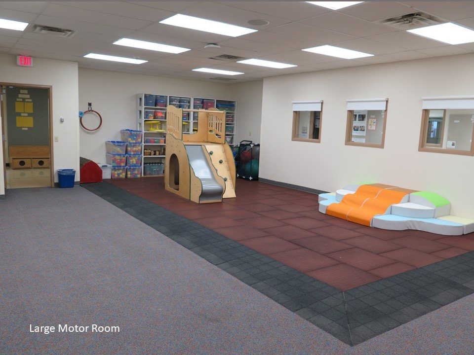 The large motor room that provides space to work large motor muscles. There is a climber and some soft mats.