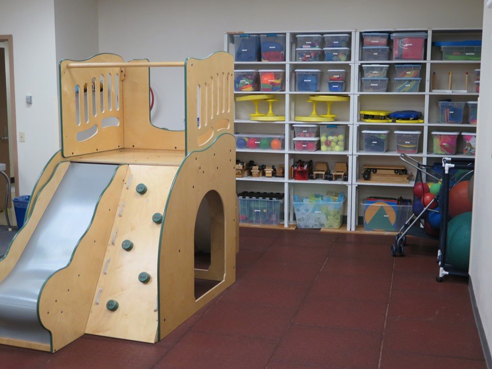 This is another view of the large motor room. It has a large climber and many different motor activities on the back shelves.