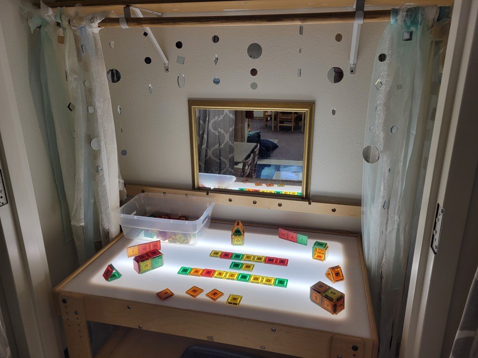 4 & 5 year old light table with magnetic letter blocks.