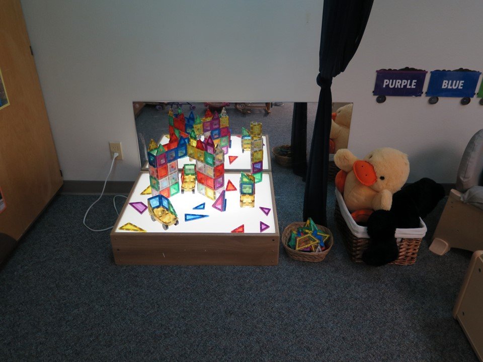 Toddler light area with translucent magnetic blocks.