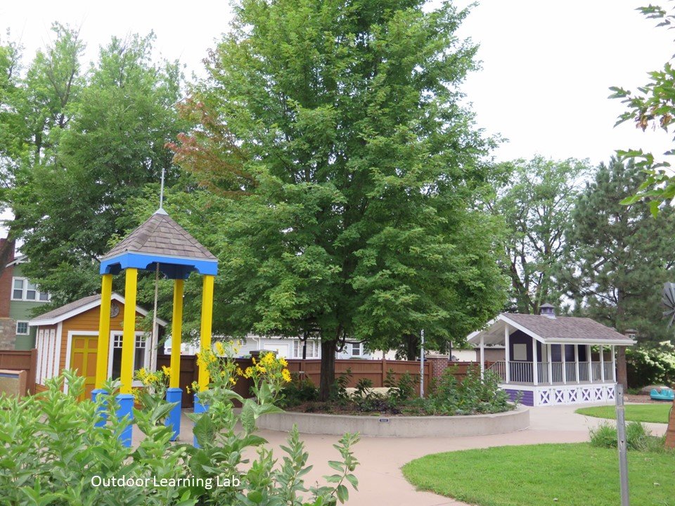 View of the playground with the mini-campanile and raised garden. 