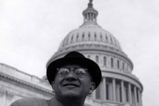 Representative Ben Reifel wearing a hat and standing in front of  the capitol building in Washington, D.C.