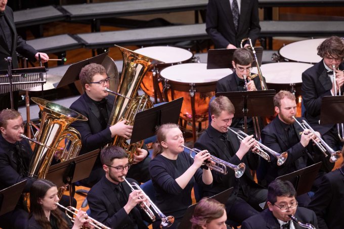 A group of SDSU students playing at a band concert