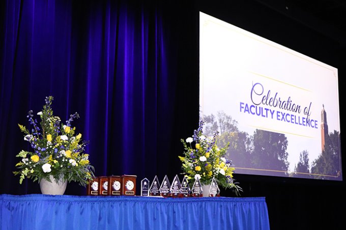 Celebration of Faculty Excellence awards table and display