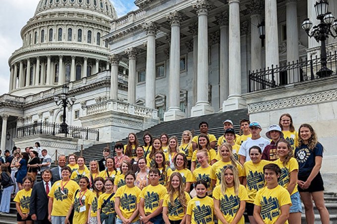 South Dakota students who recently competed in the National History Day Contest gather in front of the U.S. Capitol with U.S. Sens. Mike Rounds and John Thune.
