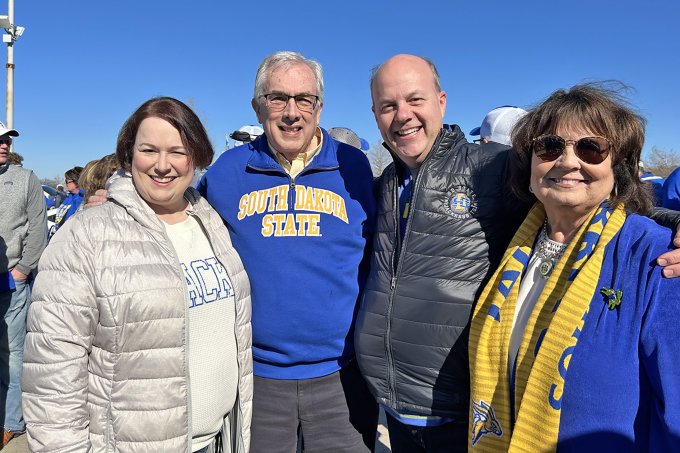 Tami Brown, Barry Dunn, Vernon Brown and Jane Dunn pose for a group photo at the FCS national championship game in Frisco, Texas.