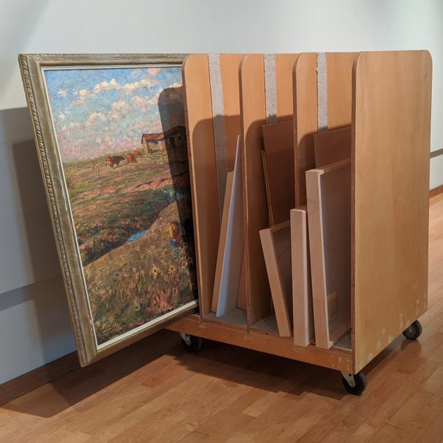 Paintings being transported on a museum cart