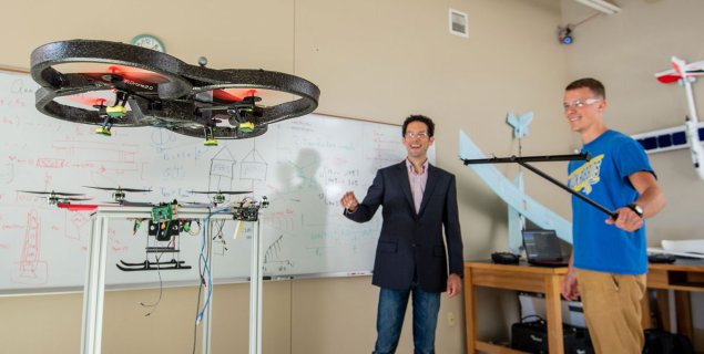 researchers flying a drone