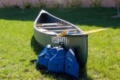 A canoe packages including two oars and two lifejackets. 