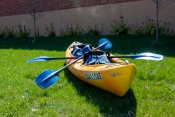 A tandem kayak package including 2 oars and 2 lifejackets.