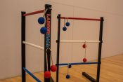 2 ladder ball stands with blue and red balls hanging for the poles
