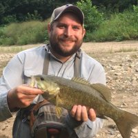 Chris with a smallmouth fish