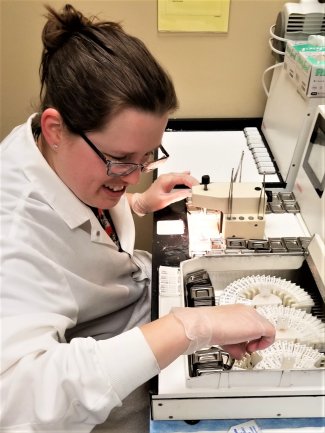 Lab employee preparing casettes