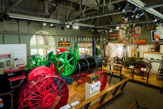 "Image of museum interior. Large 65 horsepower Case Steam Traction Engine located in center of gallery."