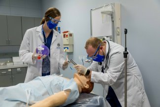 Respiratory care students completing a simulation