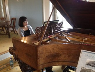 Xuan Kuang playing the grand piano