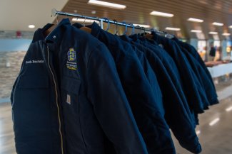 Blue Carhartt coats given to students in the Professional Program in Veterinary Medicine 