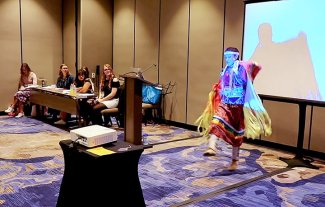 SDSU student Lindsay Hammer dances during a presentation at the National Communication Association Annual Conference in November.
