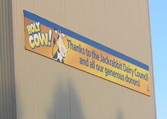 Sign on Dairy Barn that reads "Holy Cow! Thanks to the Jackrabbit Dairy Council and all our generous donors!"