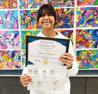 Gleven Pascual poses with winning entry for the Healthy-Decision Making Art Contest