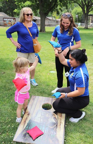 A child plays with bean bags with South Dakota State University nursing students at a health fair at the Great Plains Zoo in Sioux Falls on June 16.