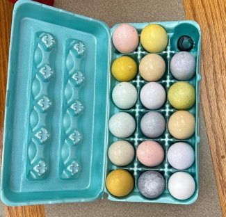 A carton of dyed Easter eggs.