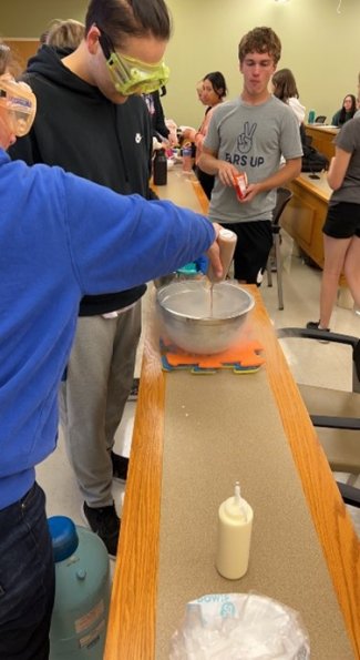 Students performing an experiment with liquid nitrogen.