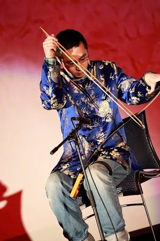 A musician performs on stage at a past China Night at South Dakota State University.