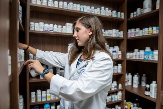 An SDSU pharmacy graduate works in a residency program.