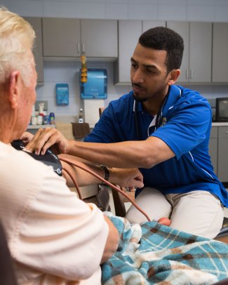 nursing taking patients blood pressure