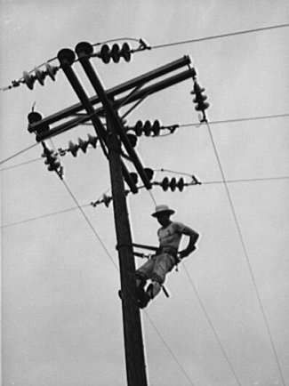 "Lineman hanging electricity lines in Missouri"